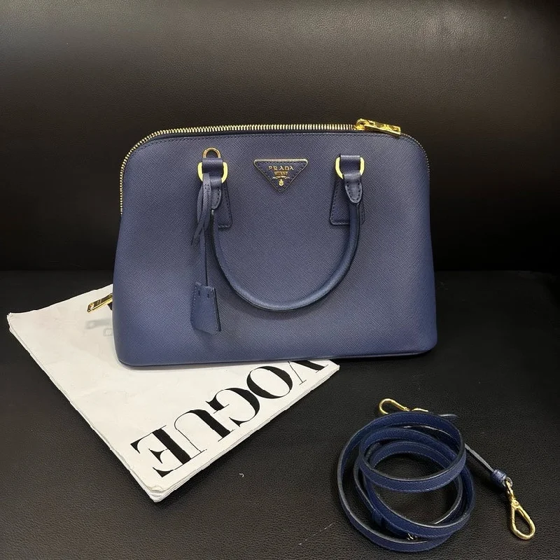 Prada Cleo bags with a contrast - colored interior for visual interestPrada Blue Cowhide Shell Bag 33cm Crossbody