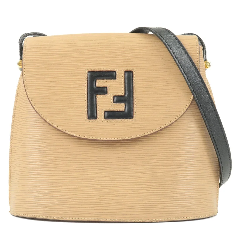 Ladies Fendi Peekaboo bags with a textured leather surface for a more tactile and luxurious feelFENDI Logo Leather Shoulder Bag Crossbody Bag Beige Black