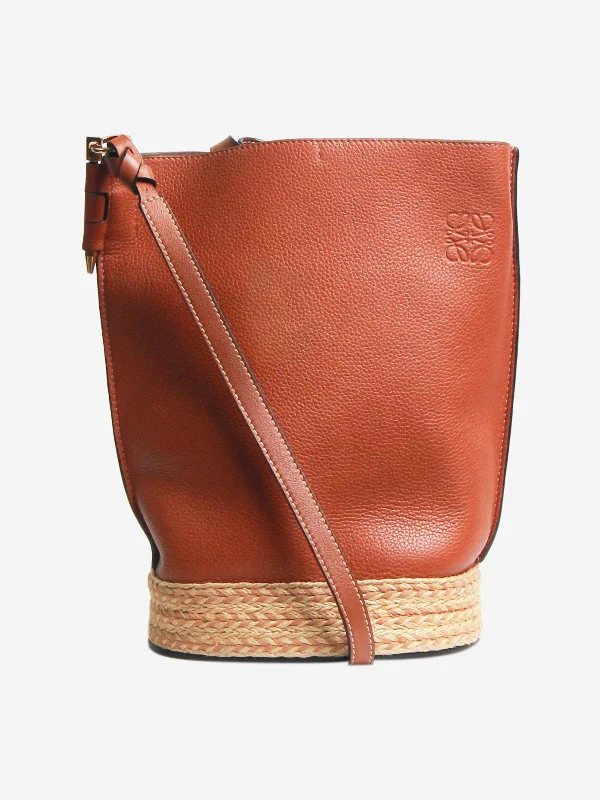 Functional Hermes Roulis Bags with Multiple CompartmentsBrown calfskin raffia Gate bucket bag